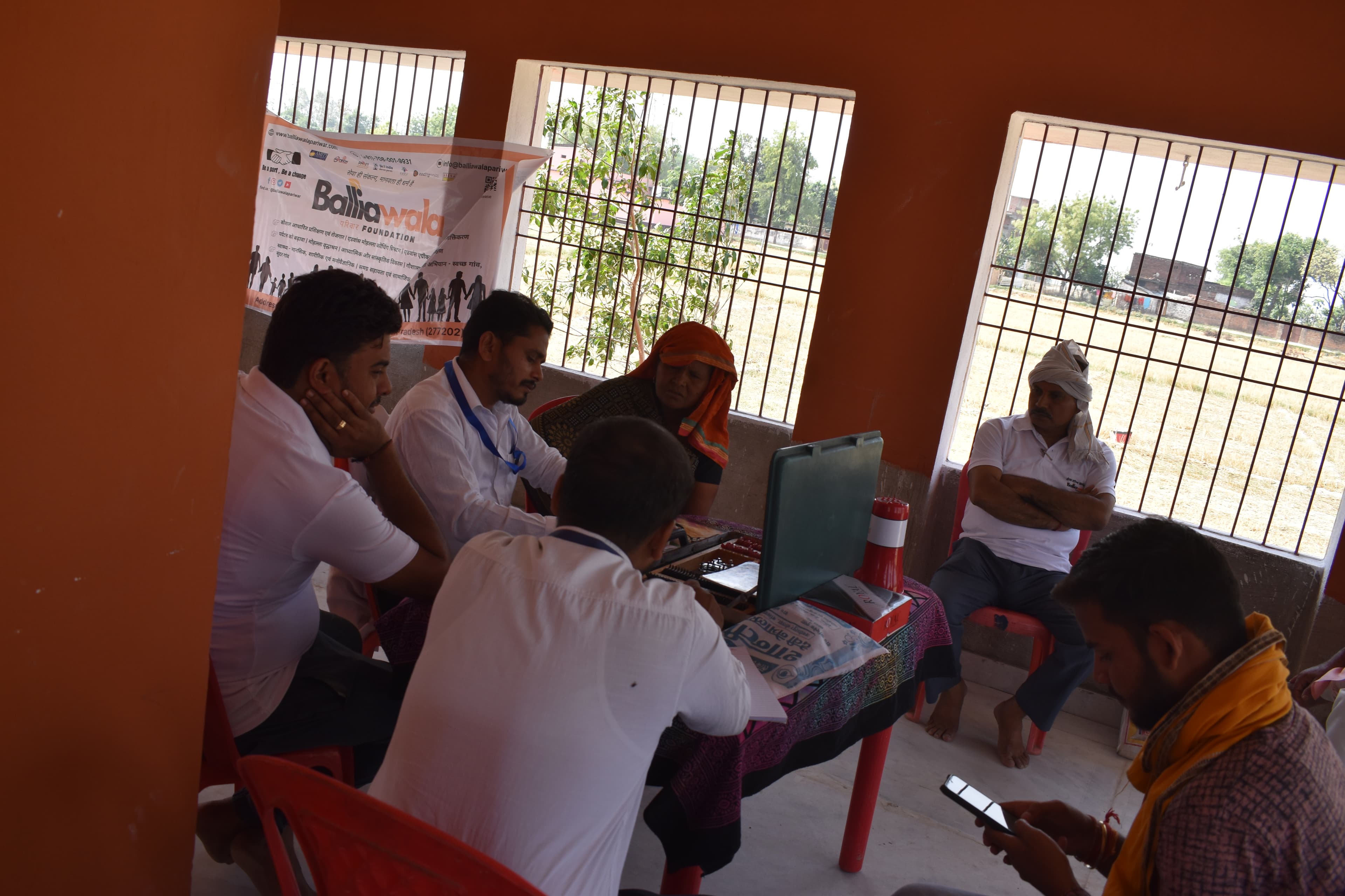 Doctor advising a local village mother on child health