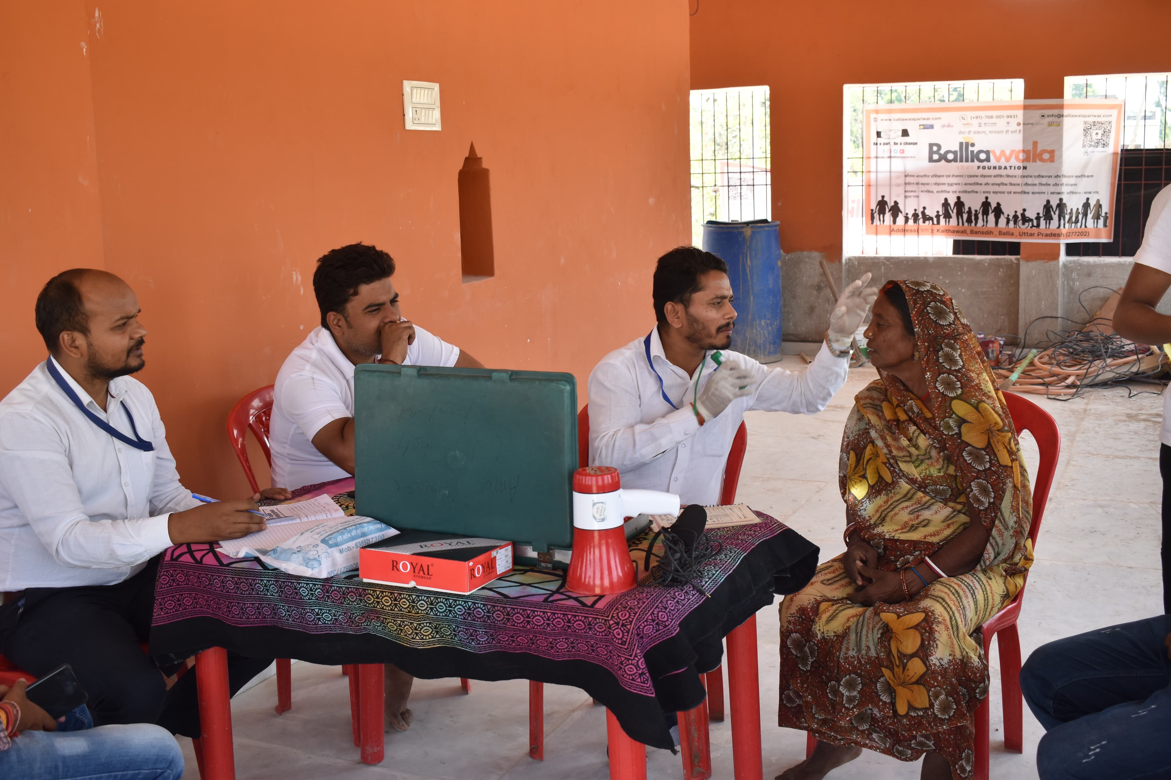 Rural healthcare doctor checking elder patient at BPF camp